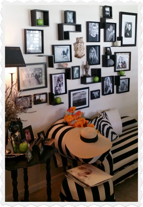 decorate a plain wall with black and white family photos